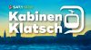 Verkehrsminister im besonderen Verkehrsmittel: Oliver Krischer im Seilbahn-Interview (Foto: SAT.1 NRW)